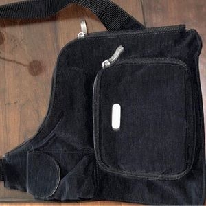 Baggallini over the sling side bag . Black new without tags . Retails for $90